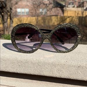 Black sunglasses with gold sparkles